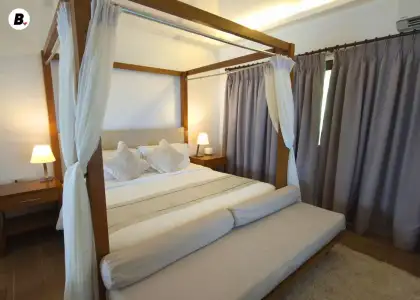 King-sized canopy bed at the Sunset Villa