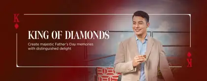 a man holding a glass of alcohol