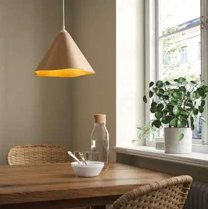 Mocha Mousse Pendant Lamp Above Dining Table Beside Window