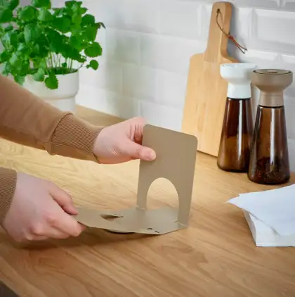 Woman Assembling Mocha Mousse Inspired Napkin Holder